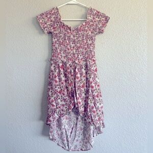 Jumper/romper/dress, shorter in the front, longer in the back, shorts under!